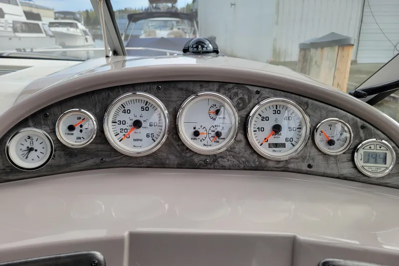 Slide: The Image of Dashboard of a 2007 Stingray 250 CS boat with various gauges and controls. - 16