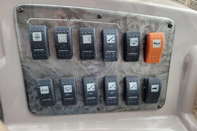 Slide: The Image of Control panel of a 2007 Stingray 250 CS boat with labeled switches. - 20