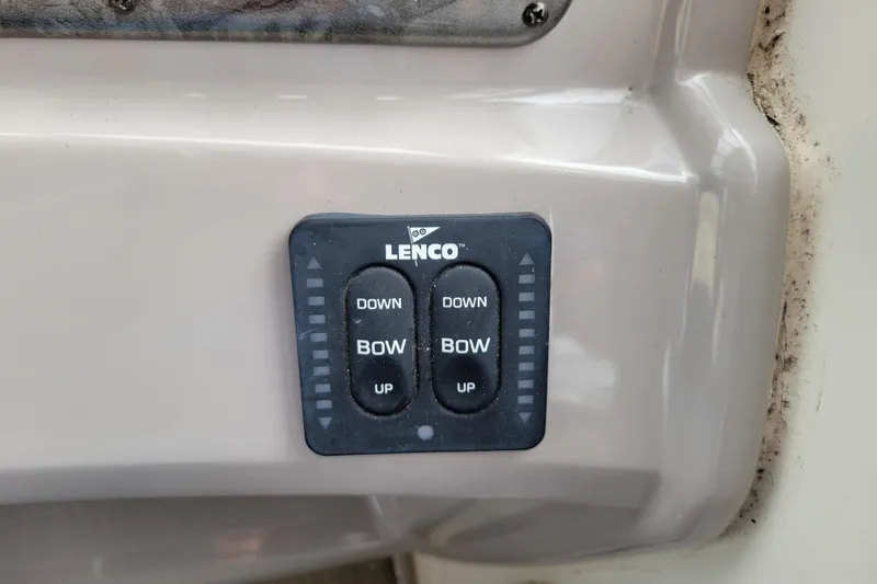 Slide: The Image of Lenco trim tab control panel on a 2007 Stingray 250 CS boat. - 21