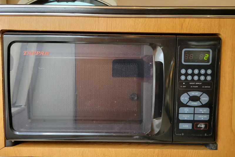 Slide: The Image of Tappan microwave oven in a 2007 Stingray 250 CS boat kitchen setup. - 24