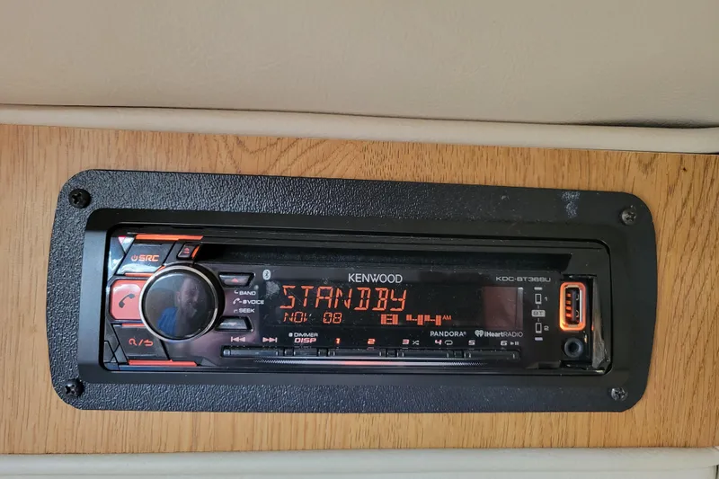 Slide: The Image of Kenwood stereo system in a 2007 Stingray 250 CS boat dashboard. - 30