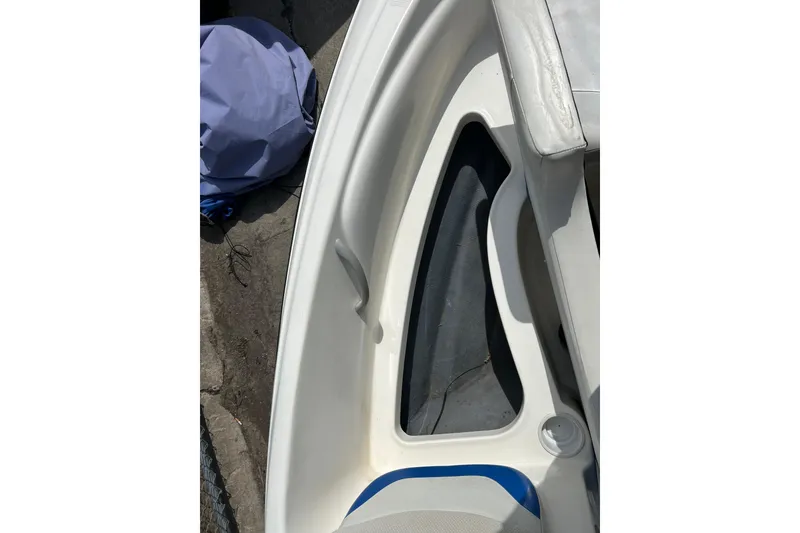 Slide: The Image of 2007 Bayliner 175 boat interior detail with seating and storage area. - 12