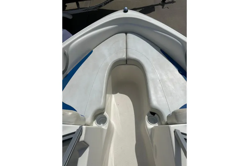 Slide: The Image of 2007 Bayliner 175 boat interior with white and blue seating. - 14