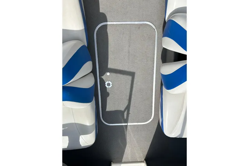 Slide: The Image of Interior view of a 2007 Bayliner 175 boat with blue and white seating. - 8