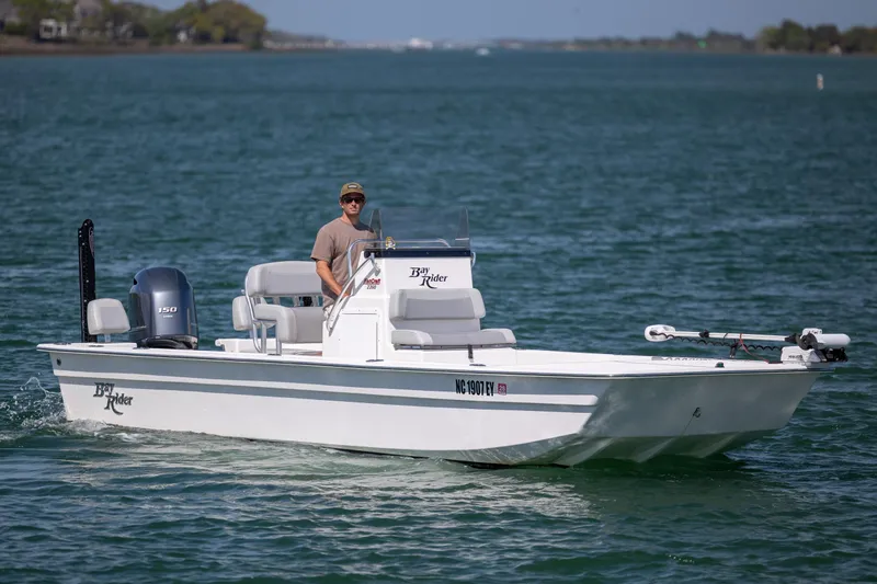 The Image of 2022 Bay Rider 2260 Skiff cruising on open water with driver. - 0