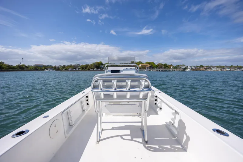 Slide: The Image of Bay Rider 2260 Skiff 2022 on calm water under blue sky. - 10