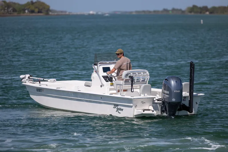 Slide: The Image of 2022 Bay Rider 2260 Skiff on water, featuring Yamaha 150 engine. - 5
