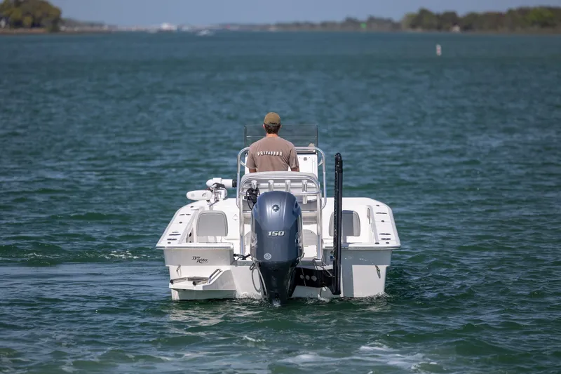 Slide: The Image of Bay Rider 2260 Skiff 2022 navigating open waters with a single outboard motor. - 6
