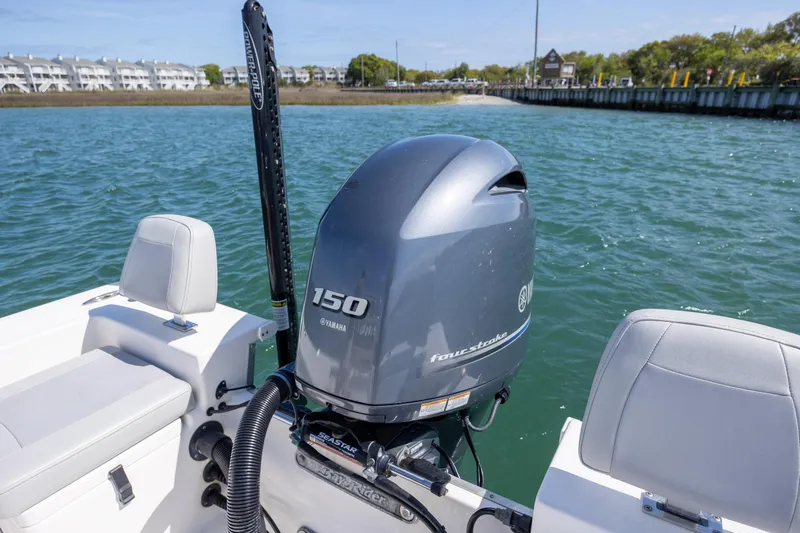 Slide: The Image of 2022 Bay Rider 2260 Skiff with Yamaha 150 engine on calm water. - 9