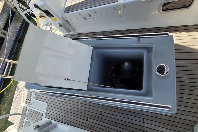 Slide: The Image of Open storage compartment on 2015 Beneteau Oceanis 45 yacht deck, showcasing interior space. - 11