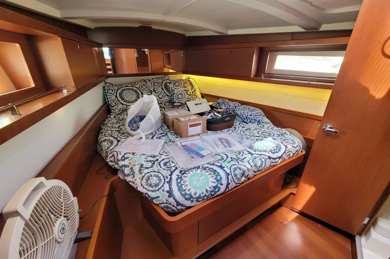 Slide: The Image of Cozy cabin interior of 2015 Beneteau Oceanis 45 yacht with patterned bedding. - 19