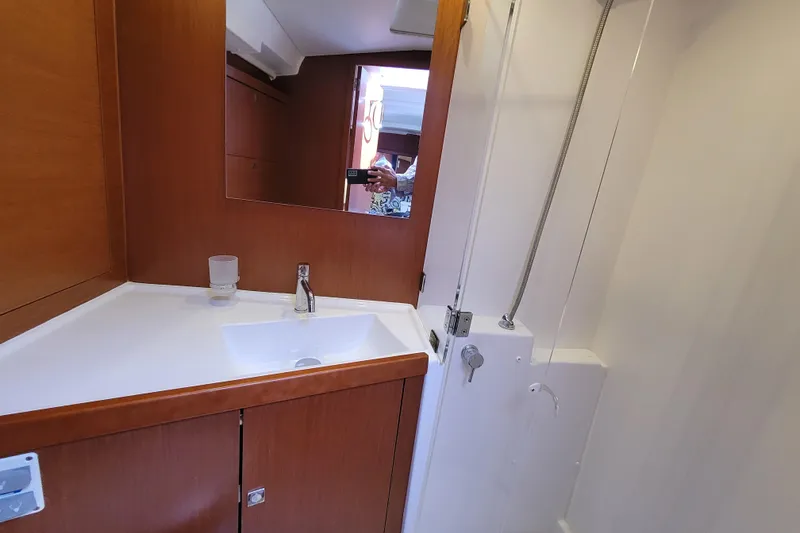 Slide: The Image of Bathroom interior of 2015 Beneteau Oceanis 45 yacht, featuring sink and shower. - 22