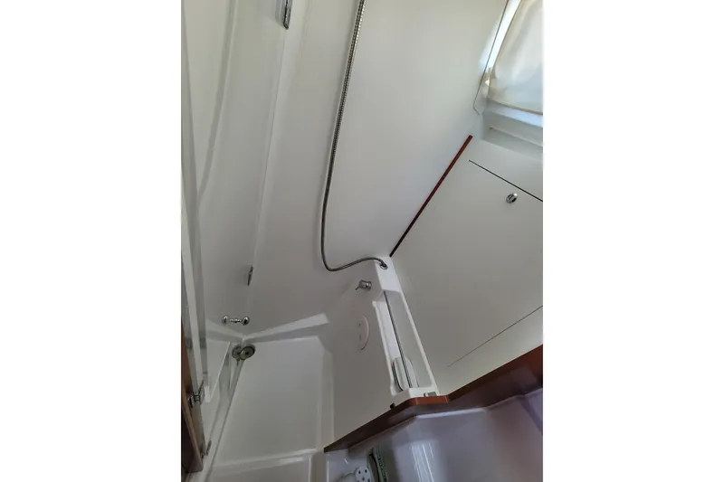 Slide: The Image of Bathroom interior of 2015 Beneteau Oceanis 45 yacht, featuring shower and storage. - 29