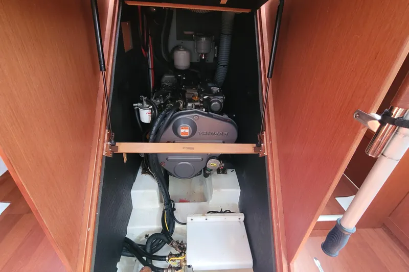 Slide: The Image of Engine compartment of a 2015 Beneteau Oceanis 45 sailboat, featuring a Yanmar engine. - 34