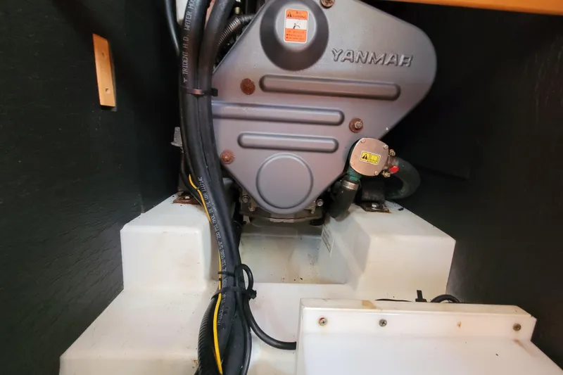 Slide: The Image of Yanmar engine in a 2015 Beneteau Oceanis 45 sailboat, showcasing mechanical components. - 35