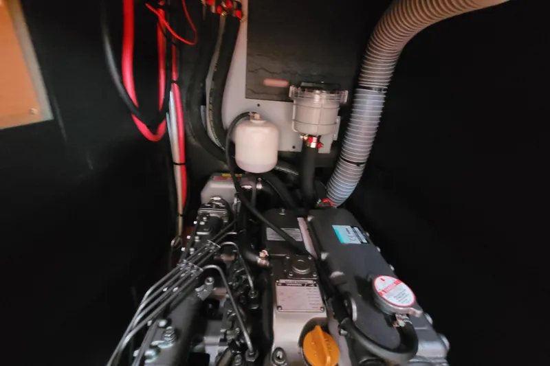 Slide: The Image of Engine compartment of a 2015 Beneteau Oceanis 45 sailboat, showcasing mechanical components. - 37