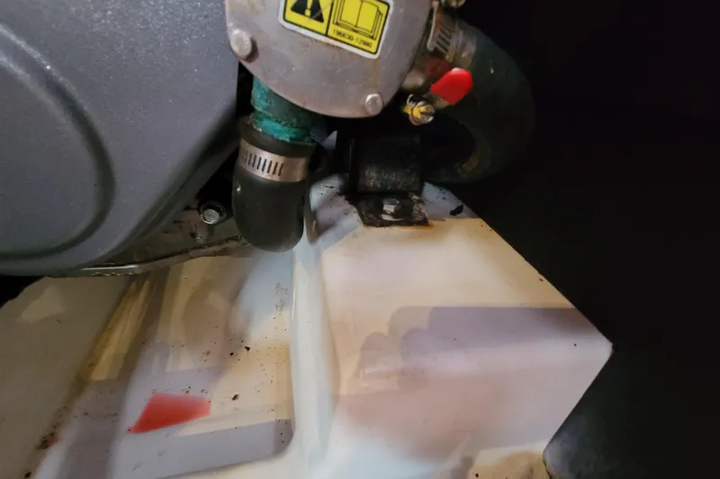 Slide: The Image of Engine compartment of a 2015 Beneteau Oceanis 45 sailboat, showing hoses and fittings. - 39