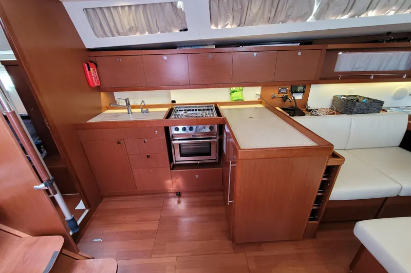 Slide: The Image of Interior of 2015 Beneteau Oceanis 45 yacht featuring a modern kitchen layout. - 40