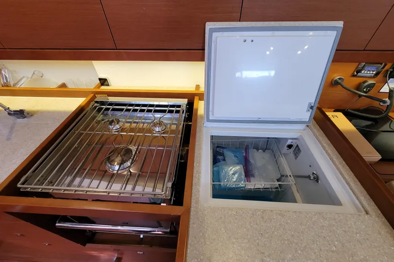 Slide: The Image of Beneteau Oceanis 45 yacht kitchen with stove and open refrigerator, 2015 model. - 42