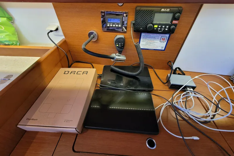 Slide: The Image of Navigation station on a 2015 Beneteau Oceanis 45 yacht with communication equipment. - 46