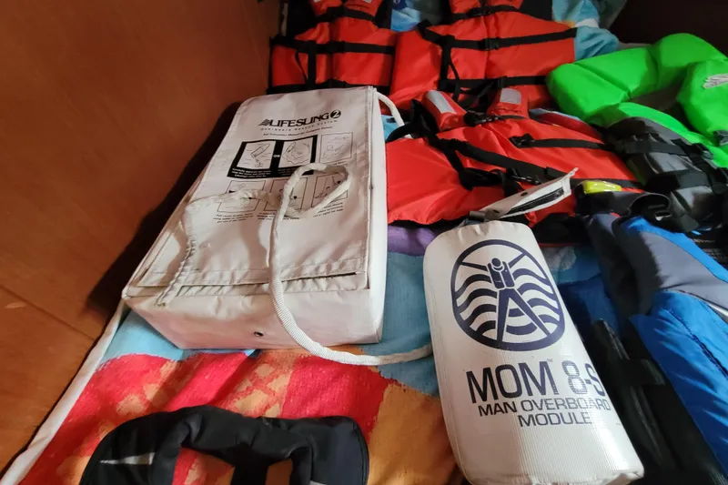 Slide: The Image of Safety equipment on a 2015 Beneteau Oceanis 45, including life vests and a man overboard module. - 56