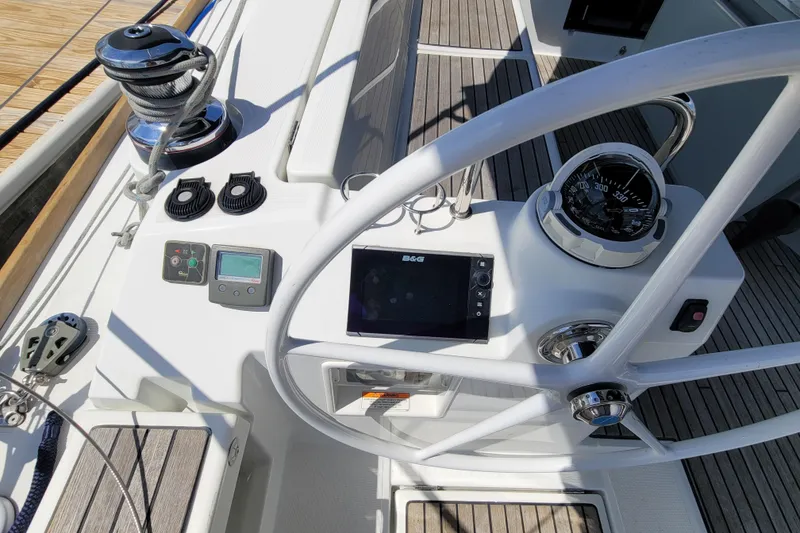 Slide: The Image of Cockpit of 2015 Beneteau Oceanis 45 sailboat with steering wheel and navigation instruments. - 8