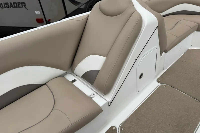 Slide: The Image of 2016 Hurricane SunDeck Sport 202 OB boat interior with beige and white seating. - 18