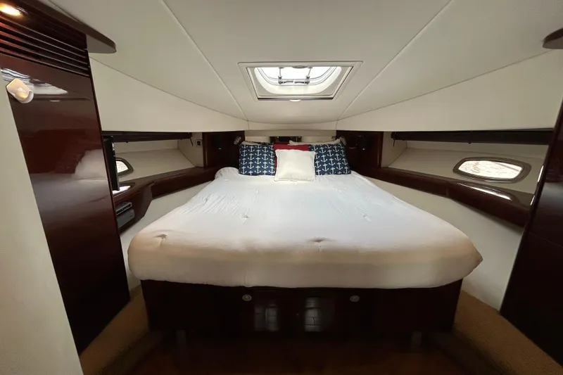 Slide: The Image of Luxurious cabin interior of 2009 Sea Ray 480 Sundancer yacht with cozy bed. - 14