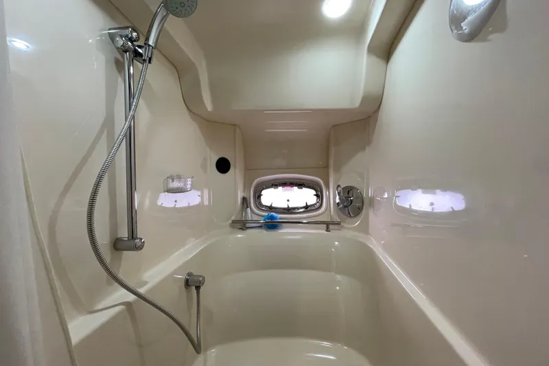 Slide: The Image of Luxurious shower area in 2009 Sea Ray 480 Sundancer yacht, featuring sleek design and modern fixtures. - 17