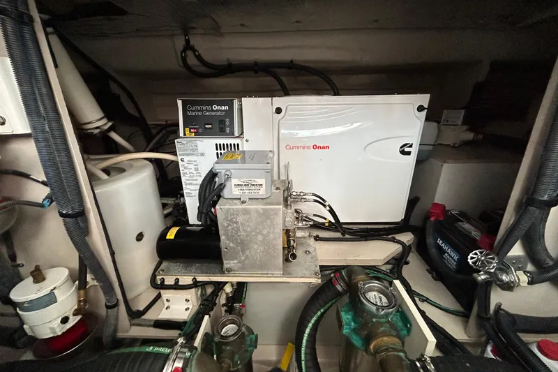 Slide: The Image of Engine room of 2009 Sea Ray 480 Sundancer with Cummins Onan marine generator. - 25