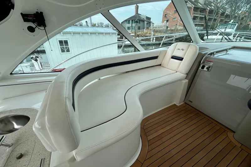 Slide: The Image of Luxurious seating area on 2009 Sea Ray 480 Sundancer yacht with wooden flooring. - 7