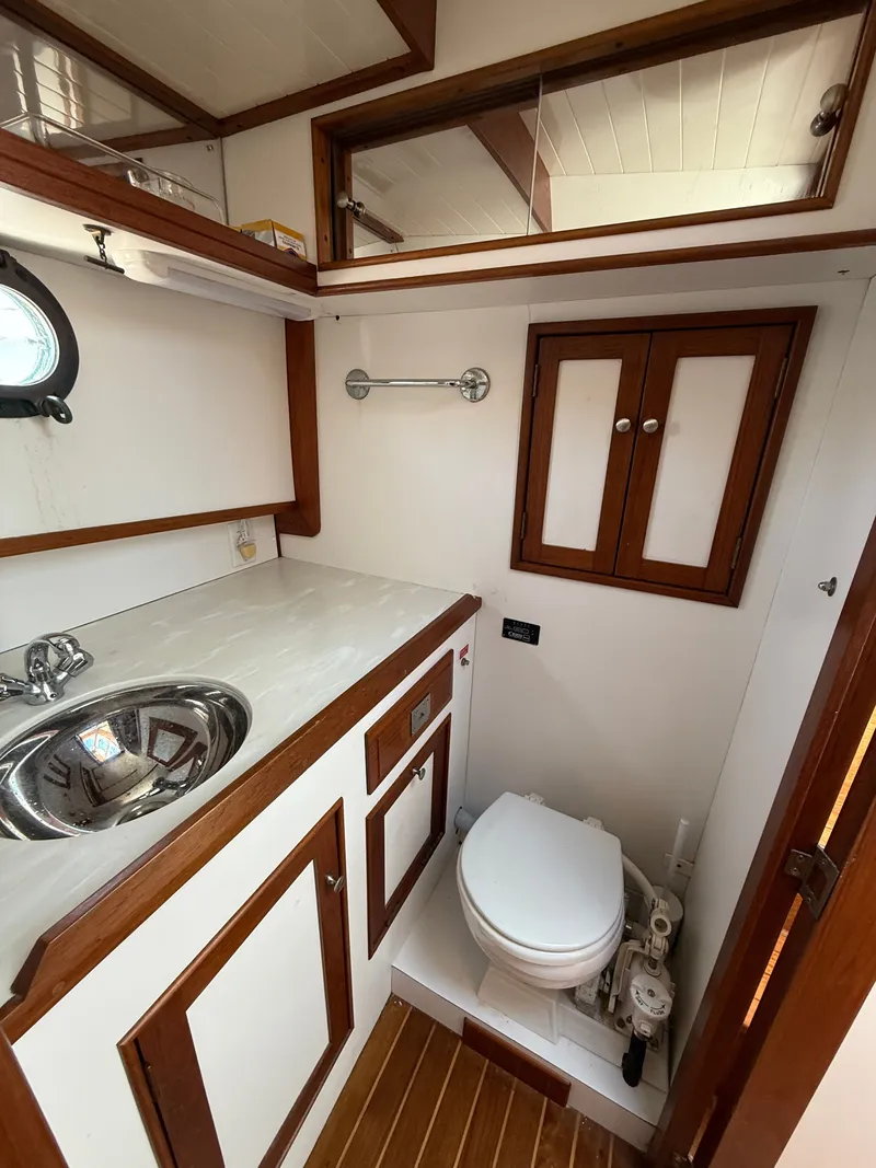 Slide: The Image of Interior of 1993 Shannon Custom Downeast 36 yacht with wooden cabinets. - 49