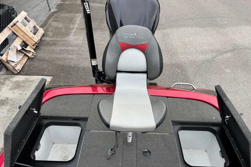 Slide: The Image of 2016 Skeeter ZX200 boat interior with seating and storage compartments. - 11