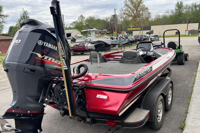 Slide: The Image of 2016 Skeeter ZX200 bass boat with Yamaha VMAX engine, parked on a trailer. - 14