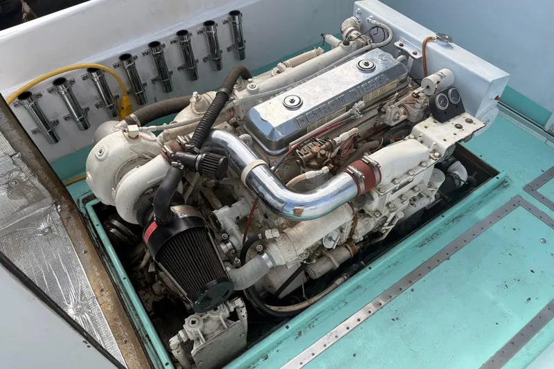 Slide: The Image of 1980 Custom Chesapeake boat engine, Detroit Diesel, with turbocharger and air filter, in turquoise compartment. - 6