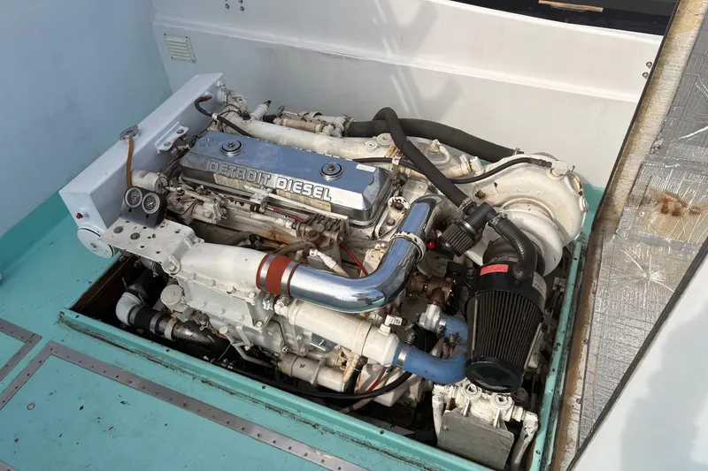 Slide: The Image of 1980 Custom Chesapeake boat engine, Detroit Diesel, in a turquoise compartment. - 7