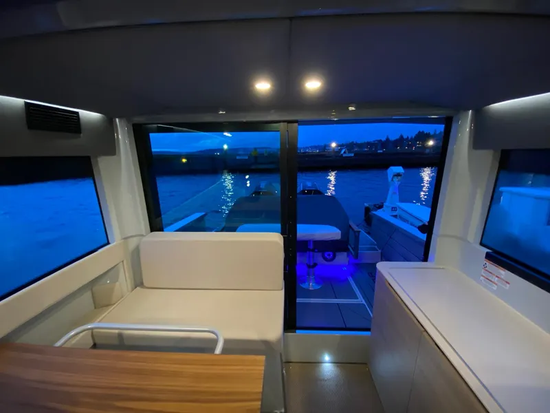 Slide: The Image of Interior view of 2025 Saxdor 320 GTC yacht at dusk. - 14