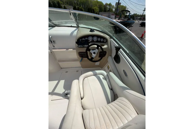 Slide: The Image of Interior view of 2003 Chaparral 230 SSi boat cockpit with steering wheel and gauges. - 11