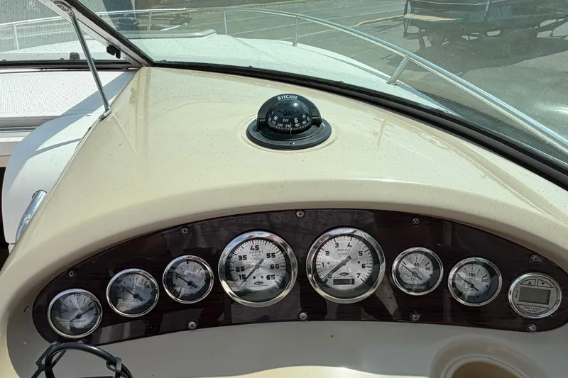 Slide: The Image of Dashboard of 2003 Chaparral 230 SSi boat with gauges and compass. - 14