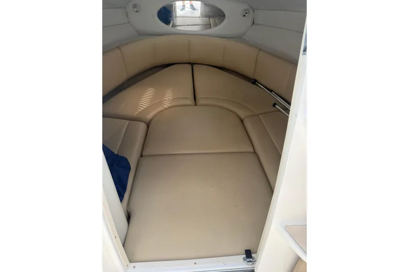 Slide: The Image of Interior cabin of 2003 Chaparral 230 SSi boat with beige seating. - 18