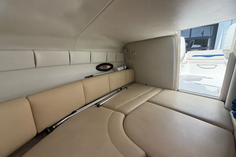 Slide: The Image of Interior cabin of a 2003 Chaparral 230 SSi boat with beige seating. - 19