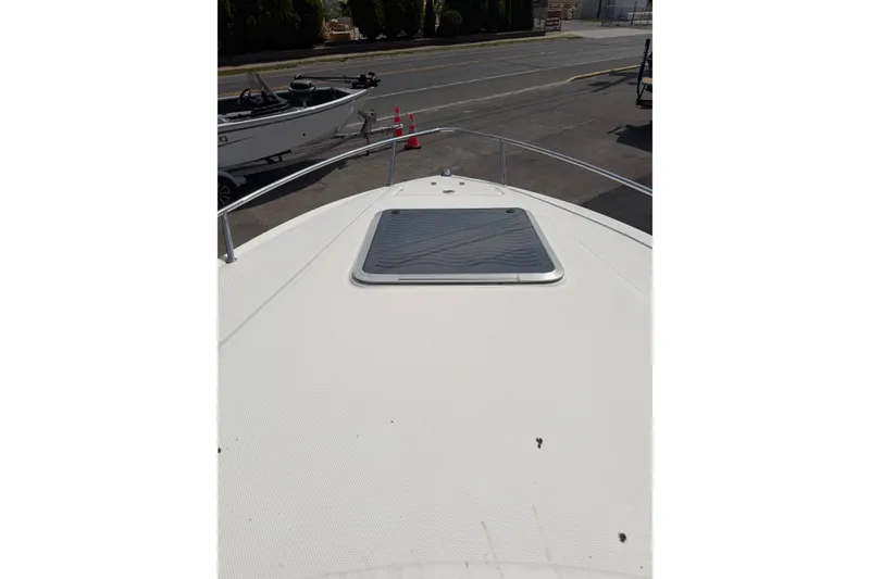 Slide: The Image of Bow view of 2003 Chaparral 230 SSi boat with hatch and railing. - 22