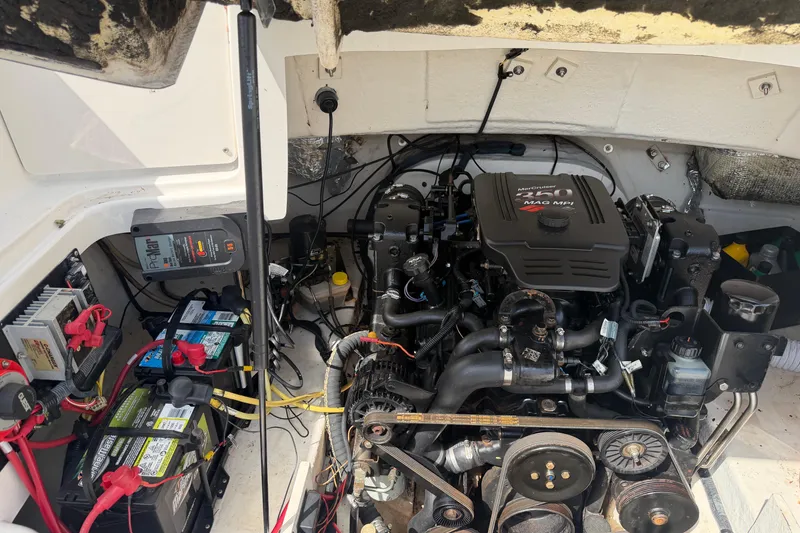 Slide: The Image of Engine compartment of a 2003 Chaparral 230 SSi boat, featuring a MerCruiser 5.0 MAG MPI engine. - 23