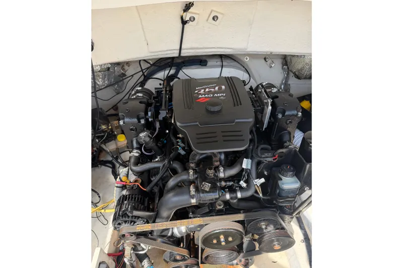 Slide: The Image of Engine of a 2003 Chaparral 230 SSi boat, featuring a MerCruiser 350 MAG MPI. - 24