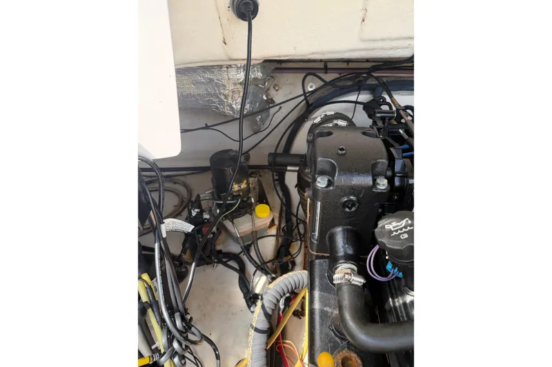 Slide: The Image of Engine compartment of a 2003 Chaparral 230 SSi boat, showing wiring and components. - 25