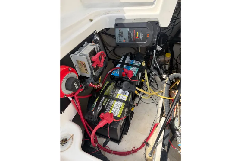 Slide: The Image of Engine compartment of a 2003 Chaparral 230 SSi boat with battery and wiring. - 26