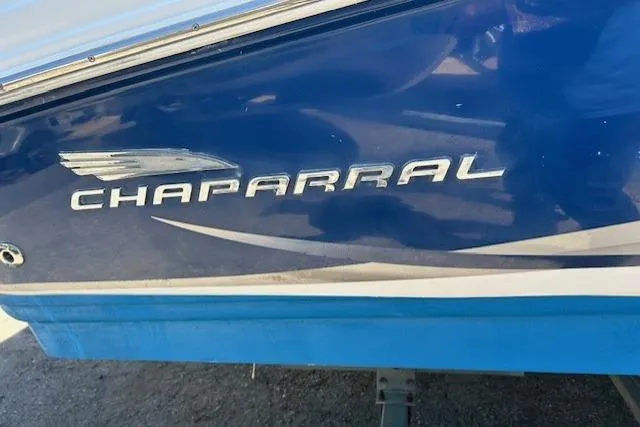 Slide: The Image of 2003 Chaparral 230 SSi boat stern with dual propeller and blue hull. - 6