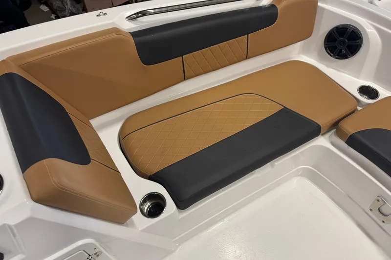 Slide: The Image of Luxurious seating in 2025 Tahoe 1950 boat, featuring tan and black upholstery. - 10