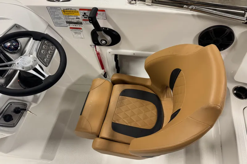 Slide: The Image of Steering wheel and tan seat in 2025 Tahoe 1950 boat cockpit. - 5