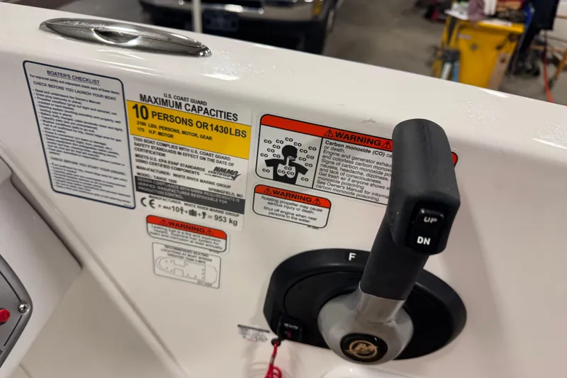 Slide: The Image of Boat control panel with capacity warnings and lever, Tahoe 1950 model, 2025. - 7